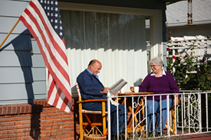 Utah reverse Mortgage couple reading on their porch